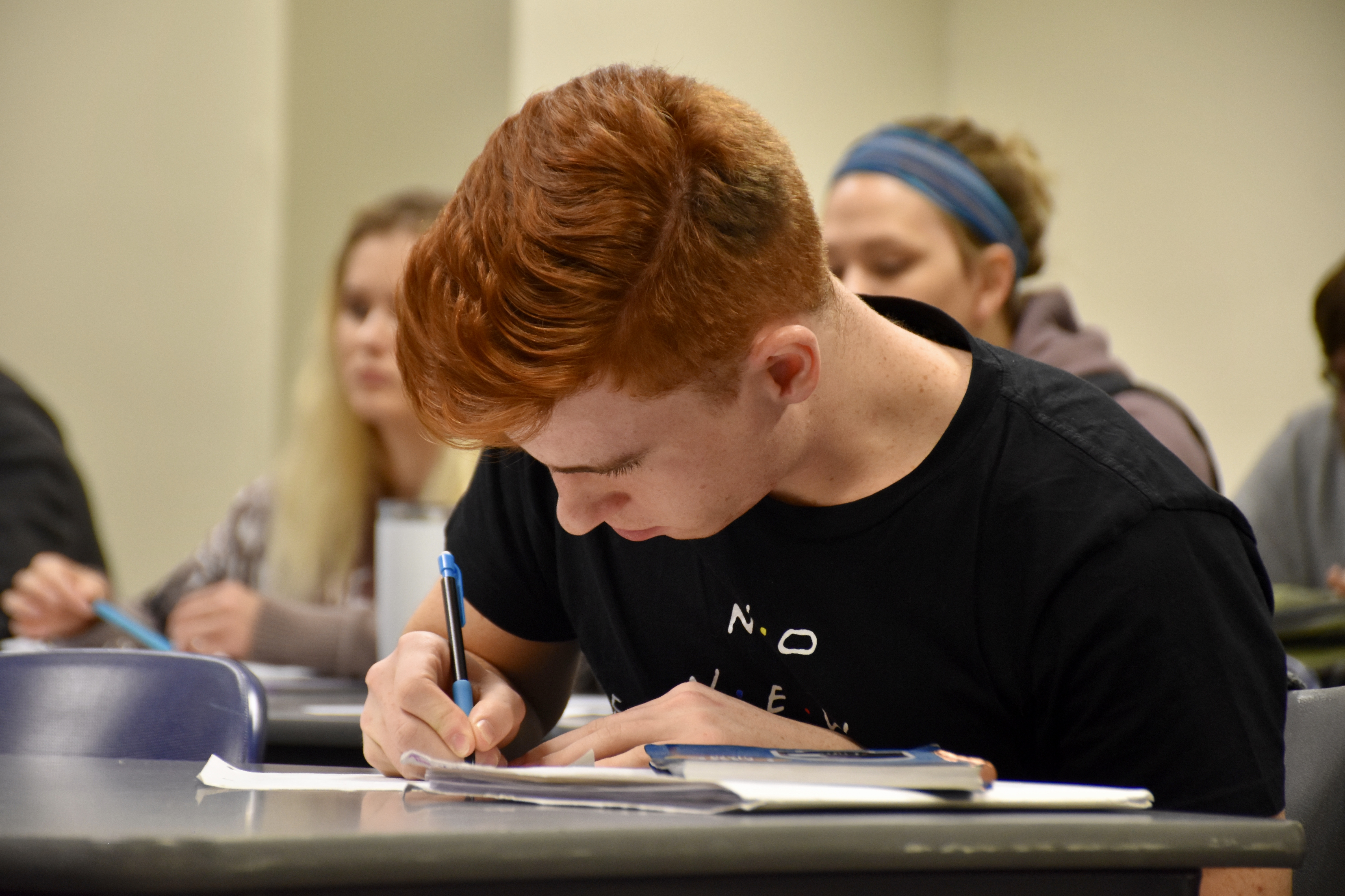 Students taking notes in class