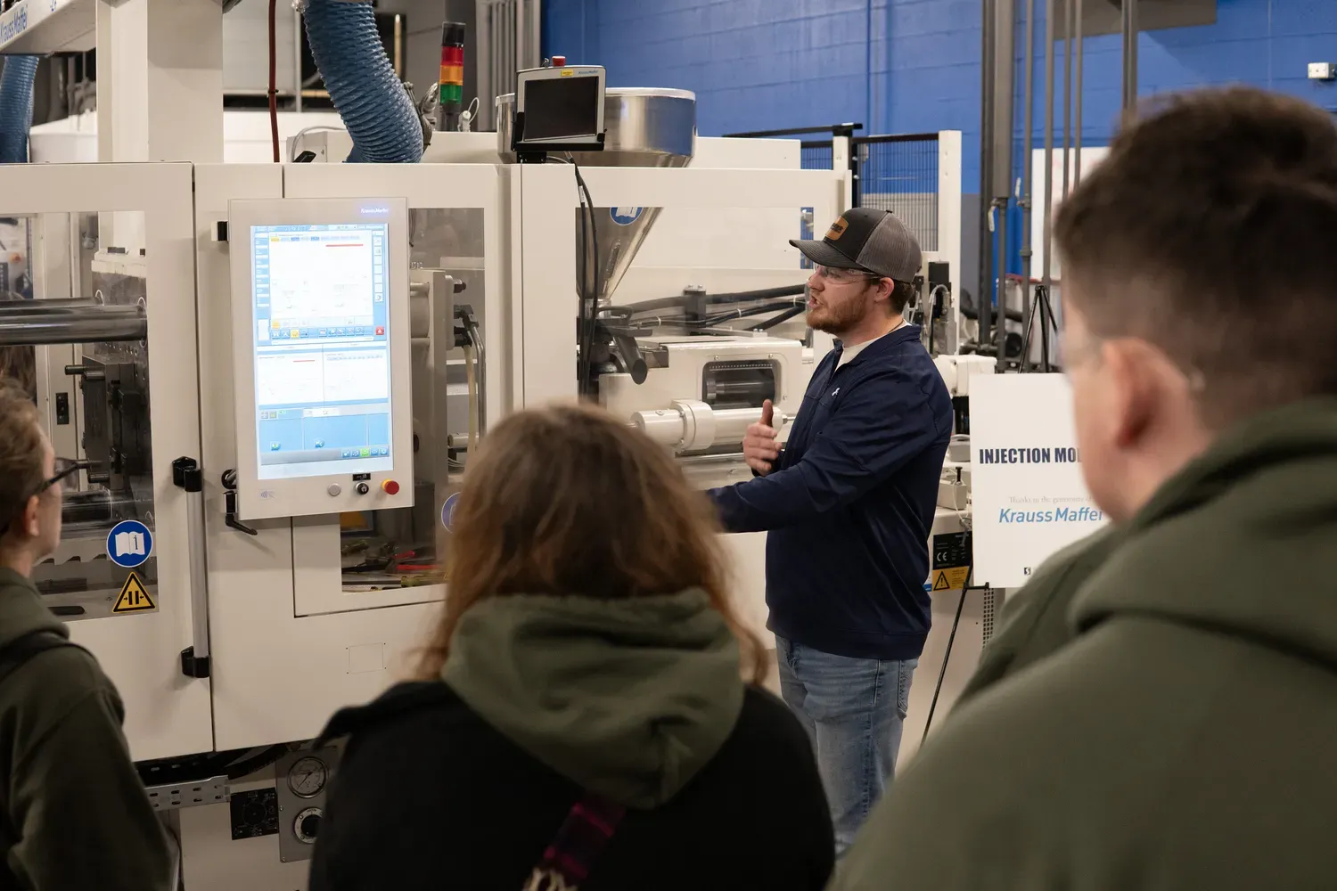 Students working with large machinery