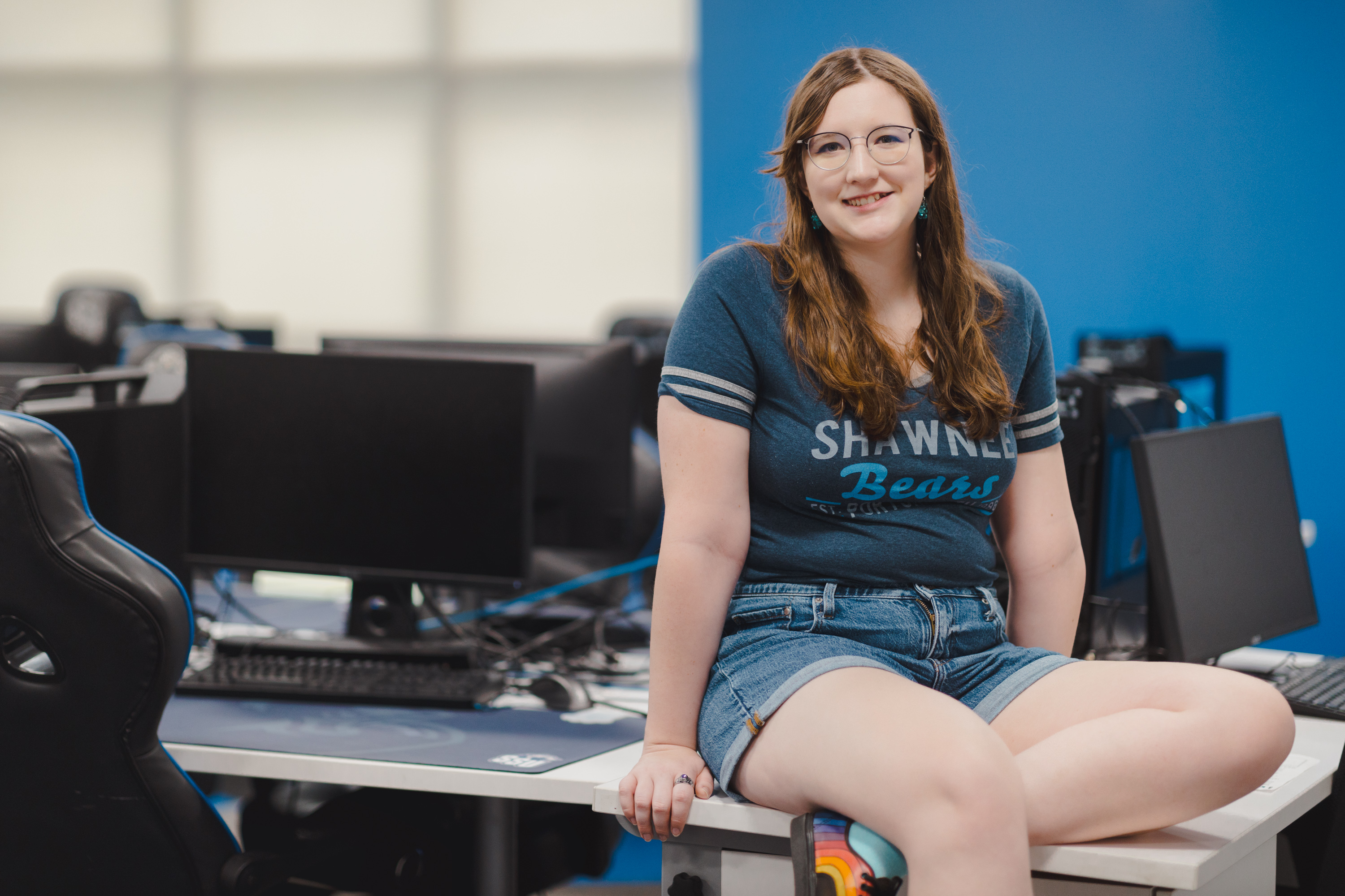 Student smiling in a computer lab