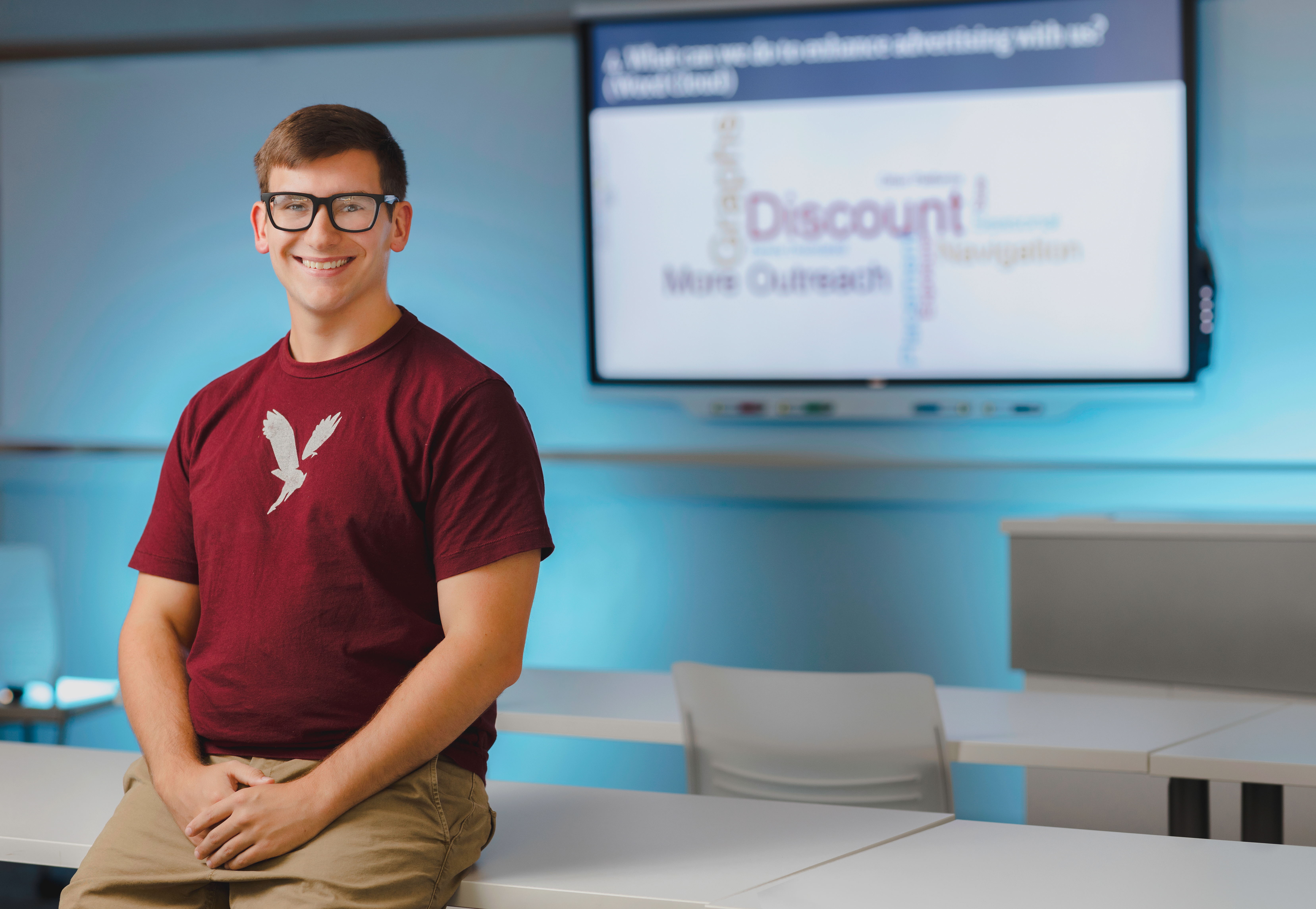 Student smiling in classroom
