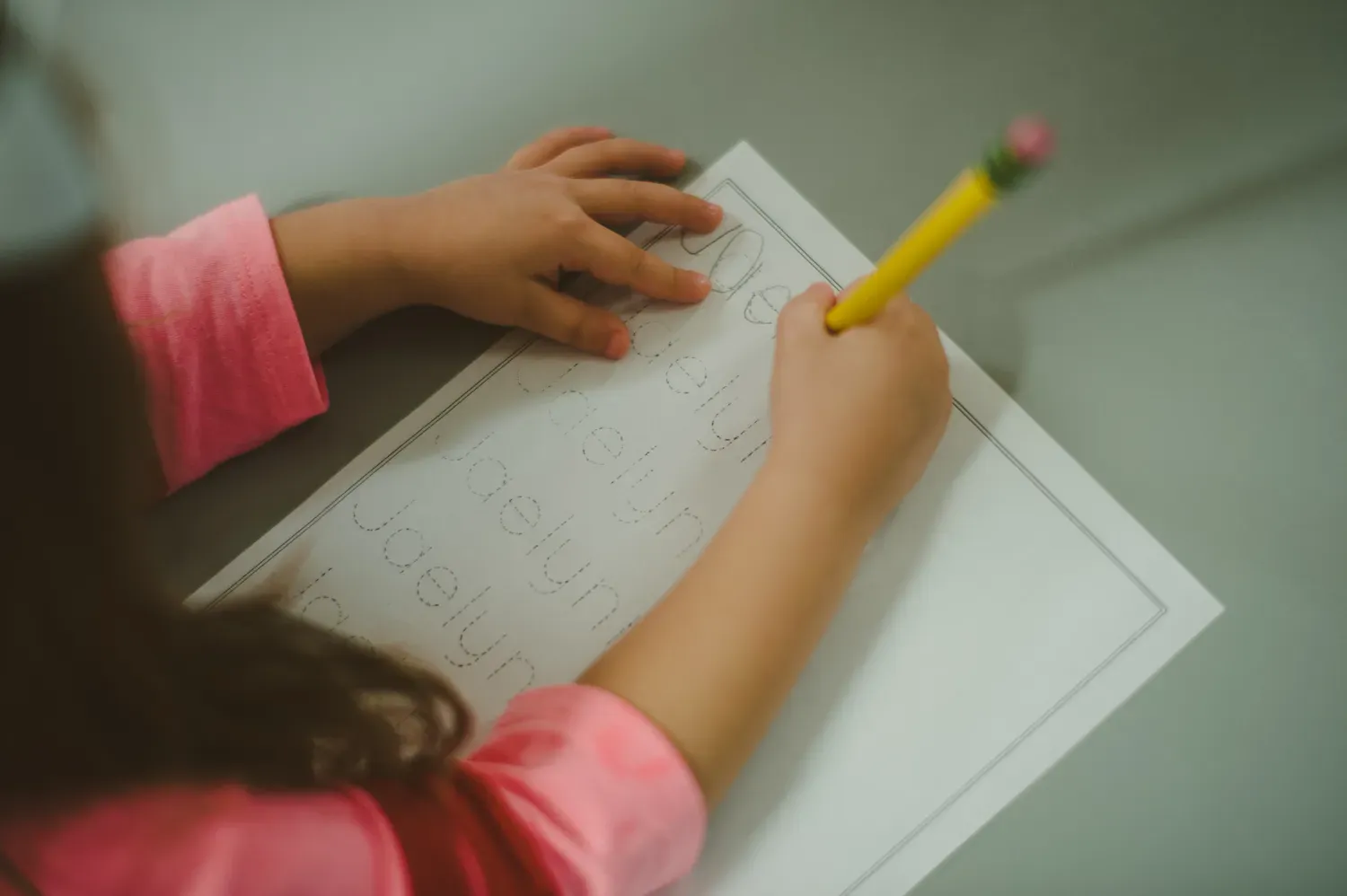 Child writing on paper