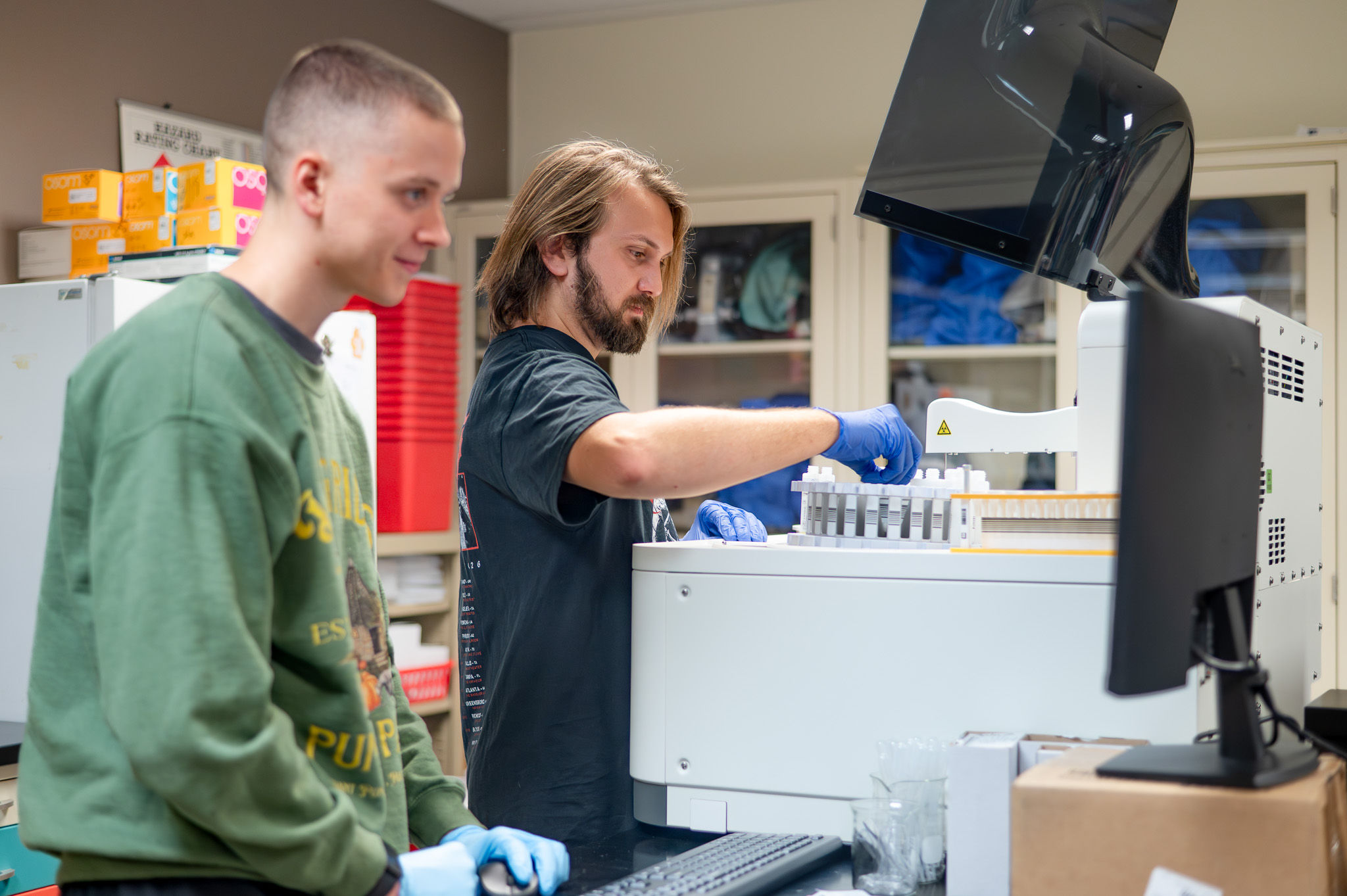 MLT students using new technology, the Diatron Pictus 500, in the lab
