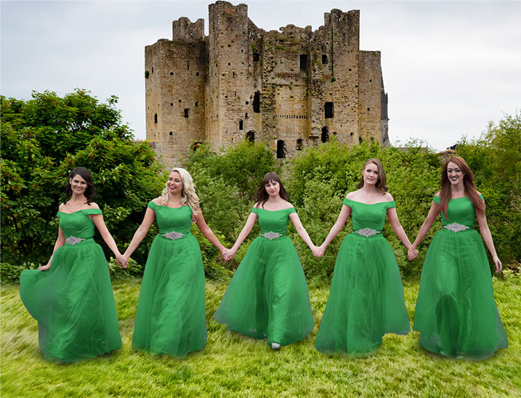 photo of dancers in front of castle