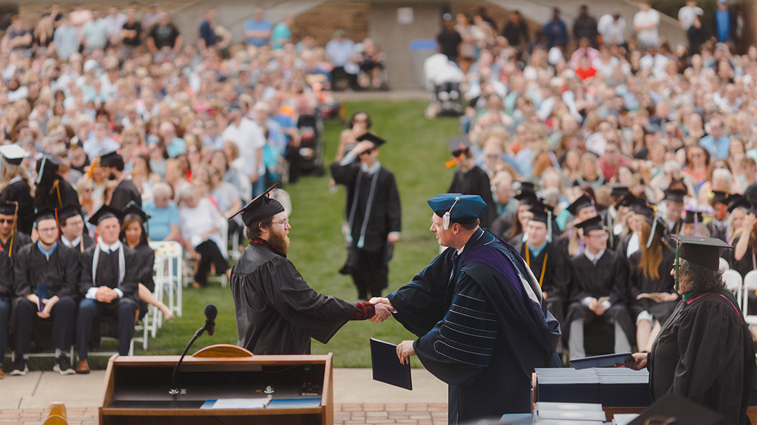 SSU graduate receiving diploma at commencement ceremony