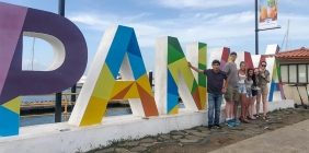 photo of students posing in front of large letters spelling "Panama"