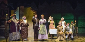 A Christmas Carol actors performing on stage