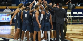 basketball team in huddle